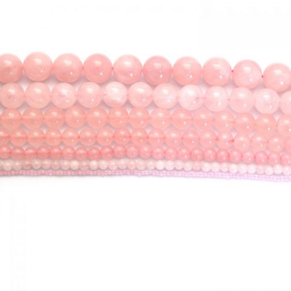 Rose quartz strand smooth round stones SCALE