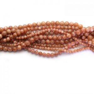 Peach moonstone strand smooth round stones group image