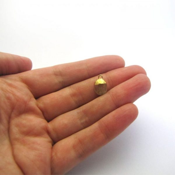 gold rutilated quartz sweet pea stone charm vermeil to scale in hand