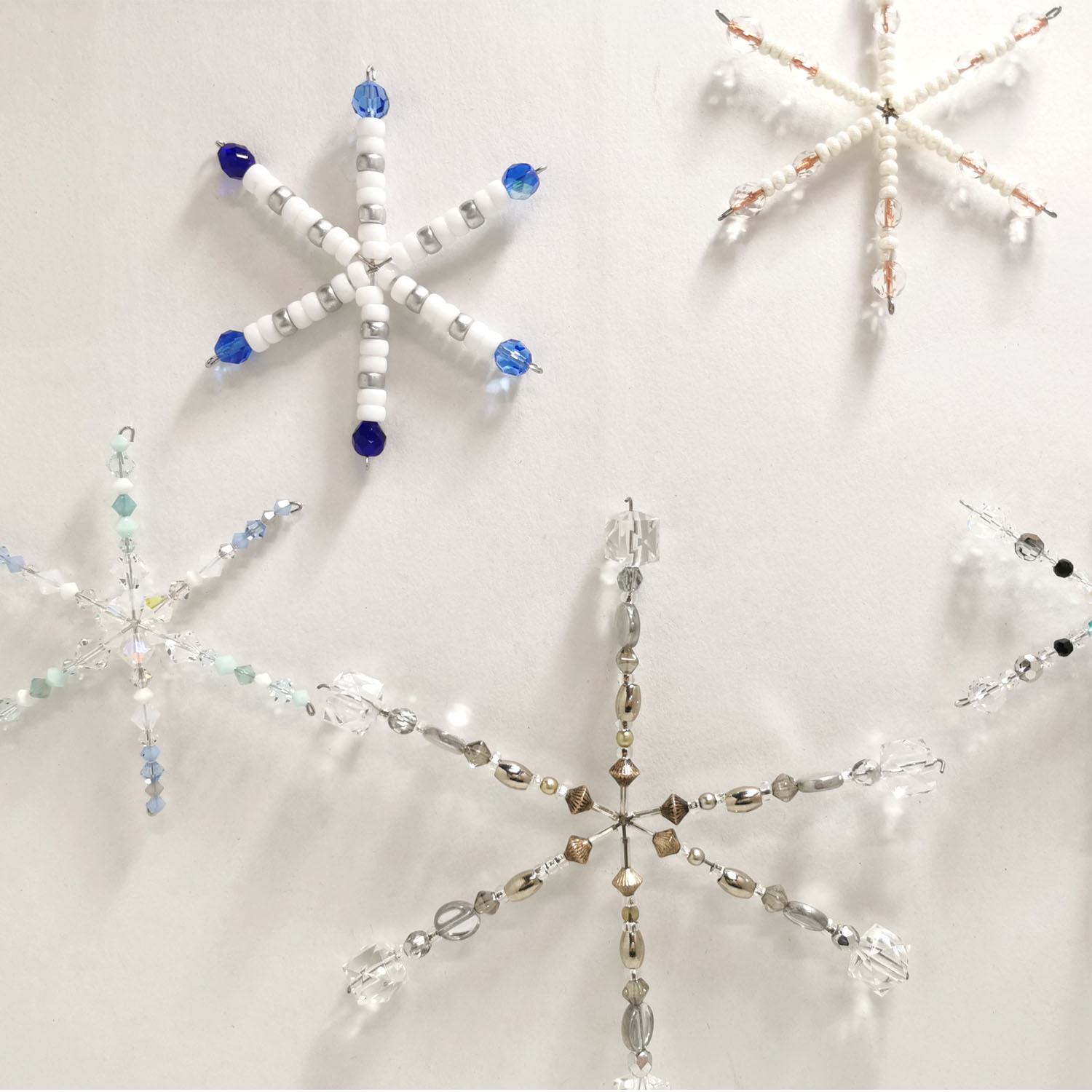 snowflake wire frame - examples of finished beaded snowflakes