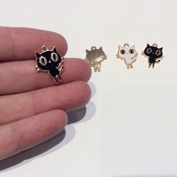 cat charm - enamel base metal showing scale