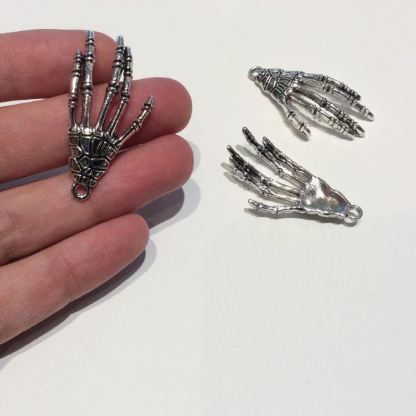 skeleton hand - base metal charm showing scale