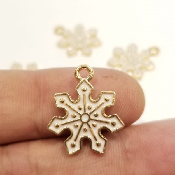 snowflake base metal charm with white enamel showing scale